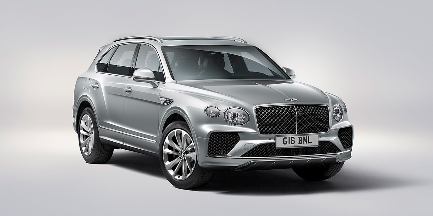 Bentley Antwerp Bentley Bentayga in Moonbeam paint, front three-quarter view, featuring a matrix grille and elliptical LED headlights.