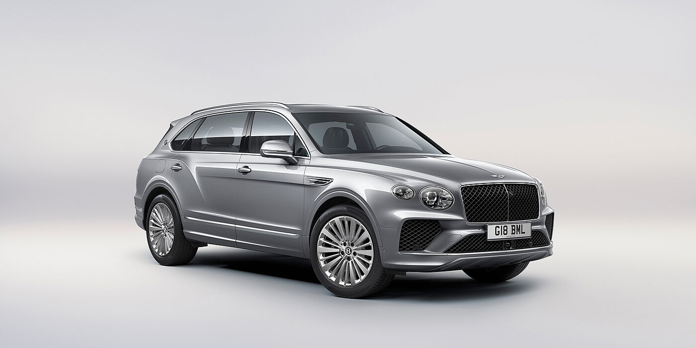Bentley Antwerp Bentley Bentayga Extended Wheelbase luxury SUV front three quarter view in Moonbeam paint with 21 inch five spoke painted wheels