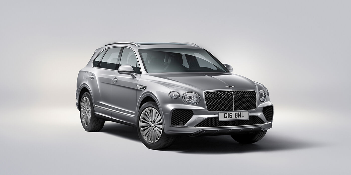 Bentley Antwerp Bentley Bentayga luxury SUV front three quarter view in Moonbeam paint with matrix grille and 21″ 5 spoke painted wheels