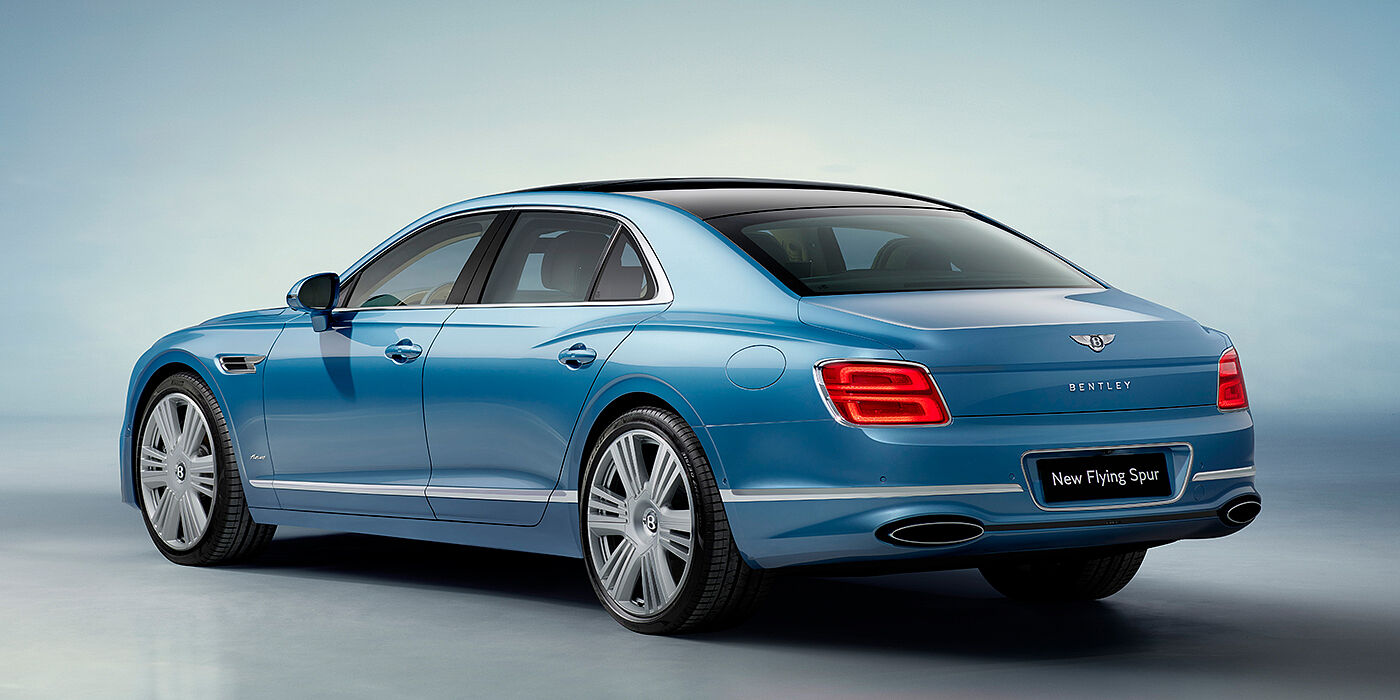 Bentley Antwerp New Bentley Flying Spur Azure sedan rear view in Light windsor blue by Mulliner paint with 22 inch Azure wheels and chrome exterior details