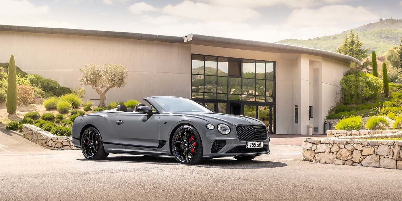 Bentley Antwerp Bentley Continental GTC S convertible in Cambrian Grey paint front 34 static near house