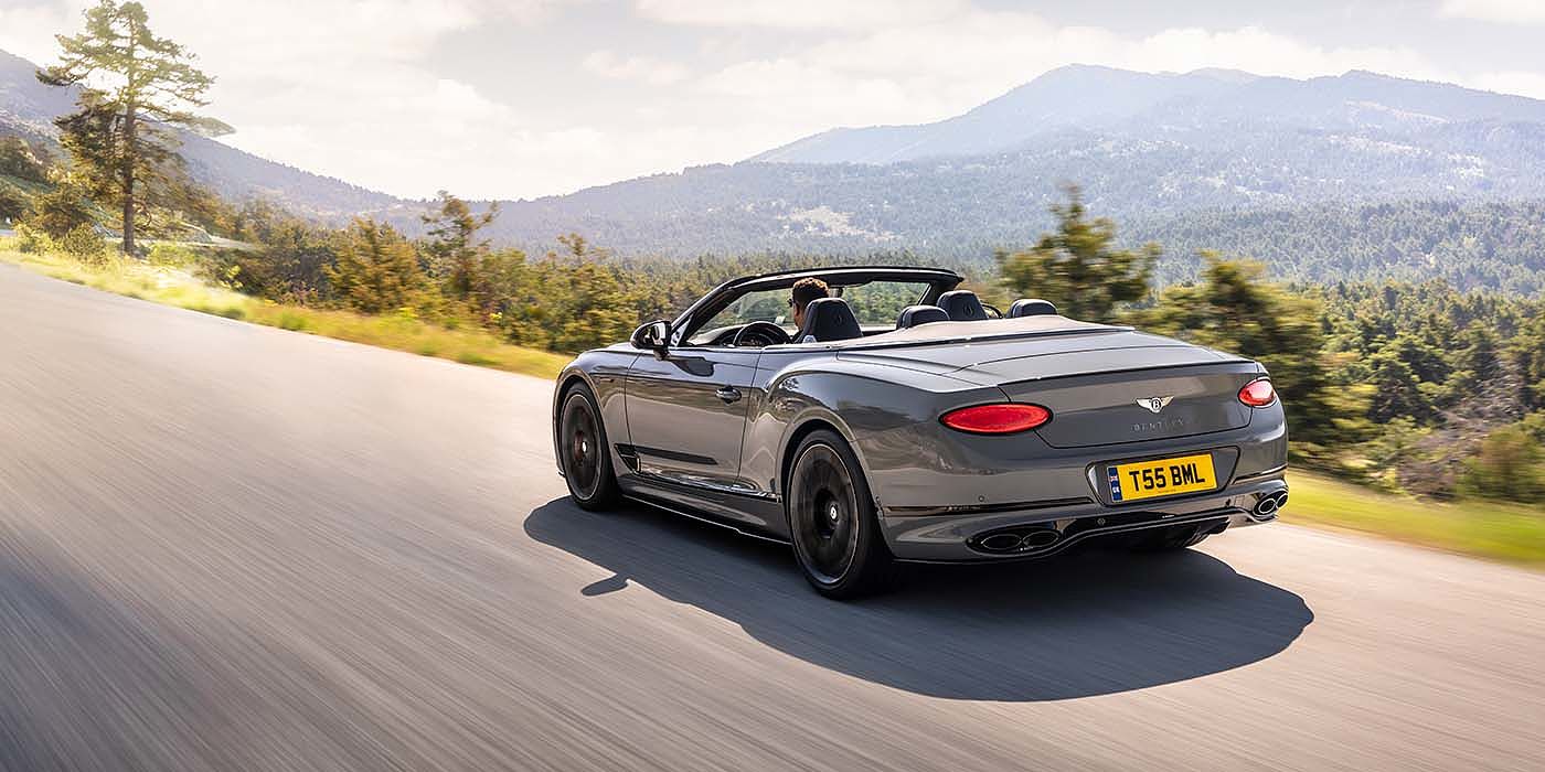 Bentley Antwerp Bentley Continental GTC S convertible in Cambrian Grey paint rear 34 dynamic driving