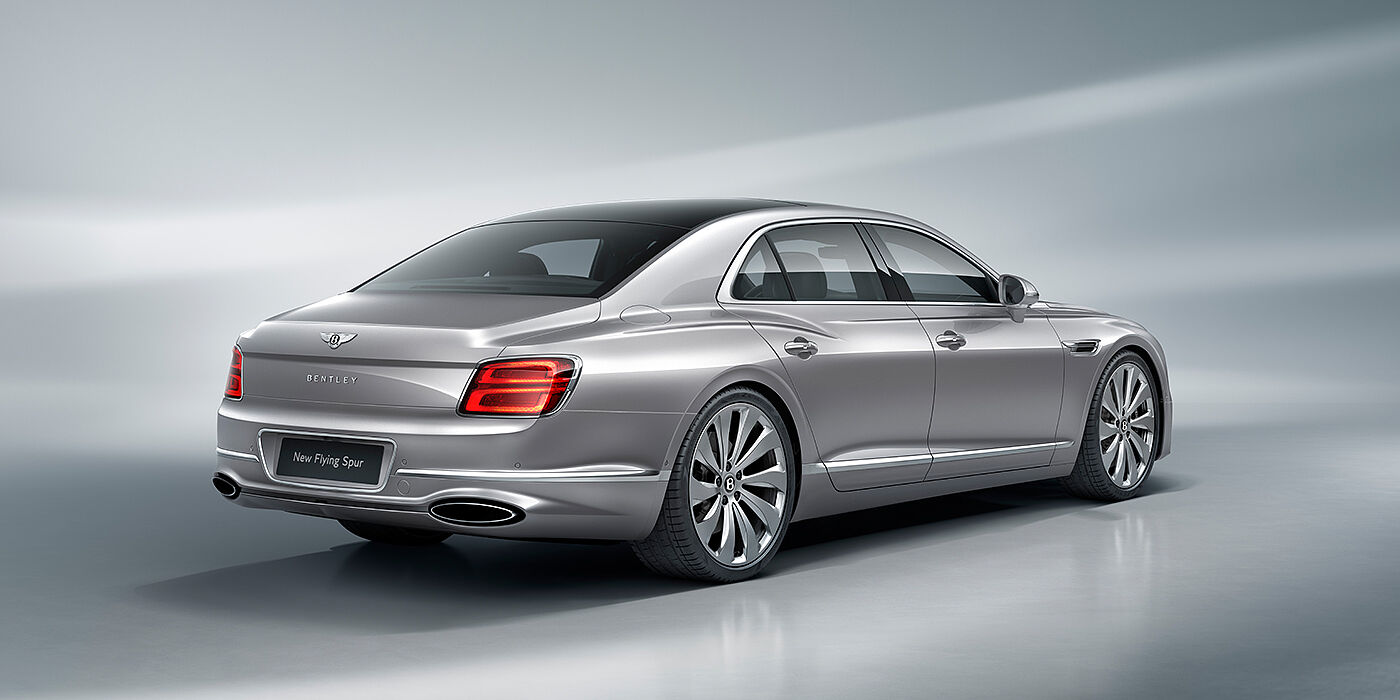Bentley Antwerp New Bentley Flying Spur sedan rear view in Silverlake paint with ten spoke wheels and chrome matrix grille