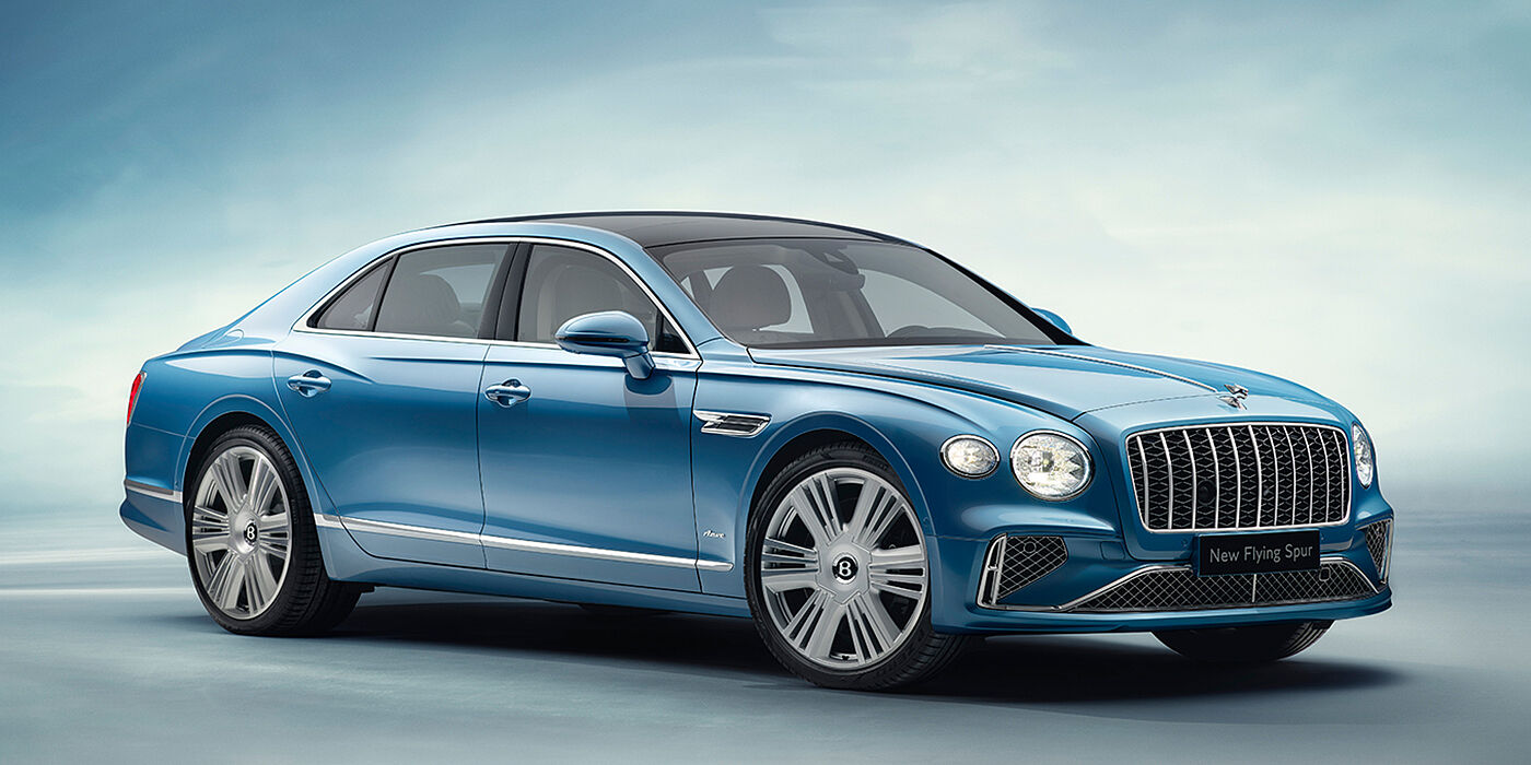 Bentley Antwerp New Bentley Flying Spur Azure sedan front view in Light windsor blue by Mulliner paint with 22 inch Azure wheels and chrome exterior details