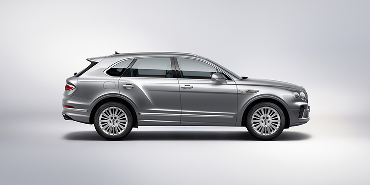 Bentley Antwerp Bentley Bentayga SUV side profile in Moonbeam silver paint against white background featuring 21 inch 5 spoke wheels